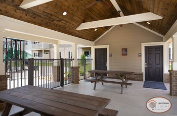Outdoor pavilion with fireplace and food area